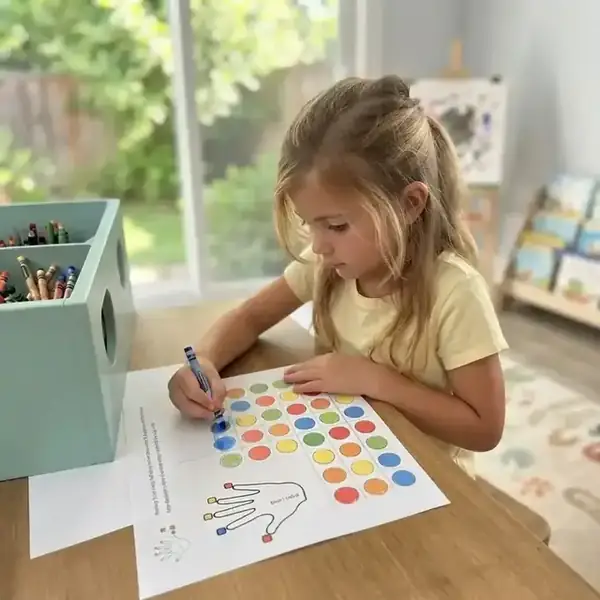 Happy child using MindKids printable brain activities at home